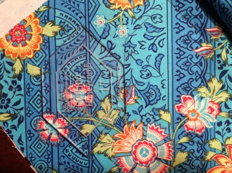 Assiduous cutting with Amy Butler's Lark fabric.