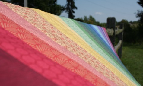 rainbow jellyroll quilt top