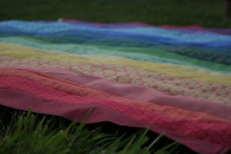 rainbow jellyroll quilt top