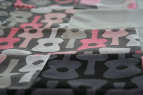 pink and grey baby plus quilt