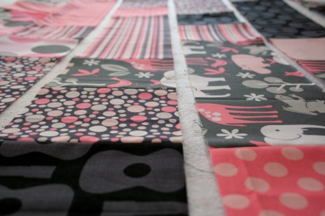 pink and grey baby plus quilt