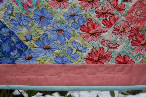free motion quilted words garden quilt