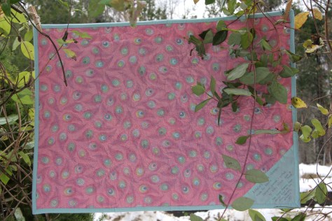 Quilt back with corner label.