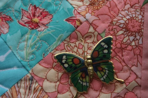 butterfly pins on garden quilt