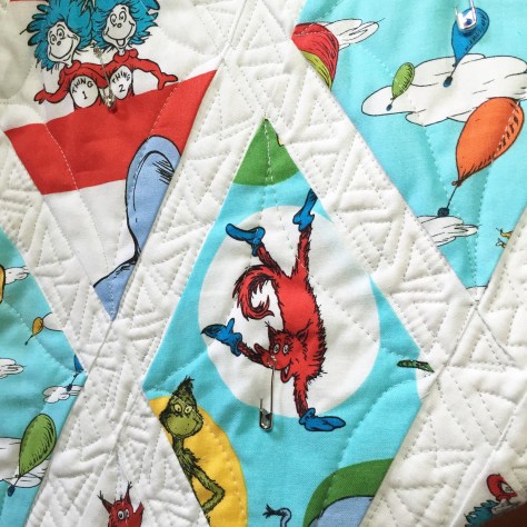 wonky triangle free motion quilting in narrow sashing