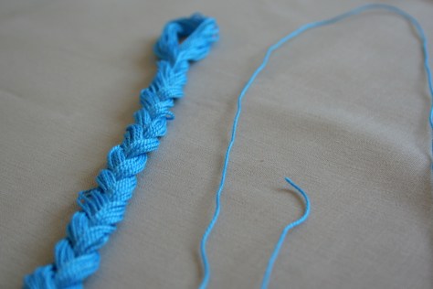 Single thread removed from embroidery floss braid