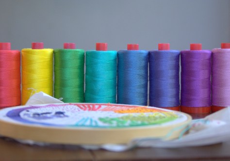 rainbow of aurifil 12wt thread and dropcloth sampler