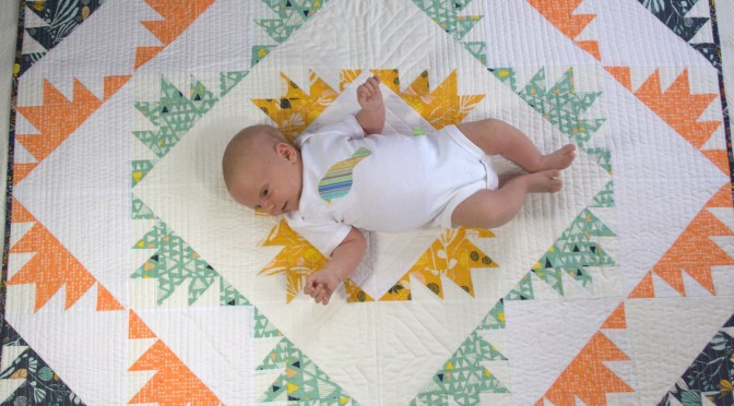 baby on quilt