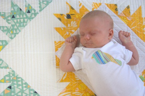 sweet sleeping babe on quilt